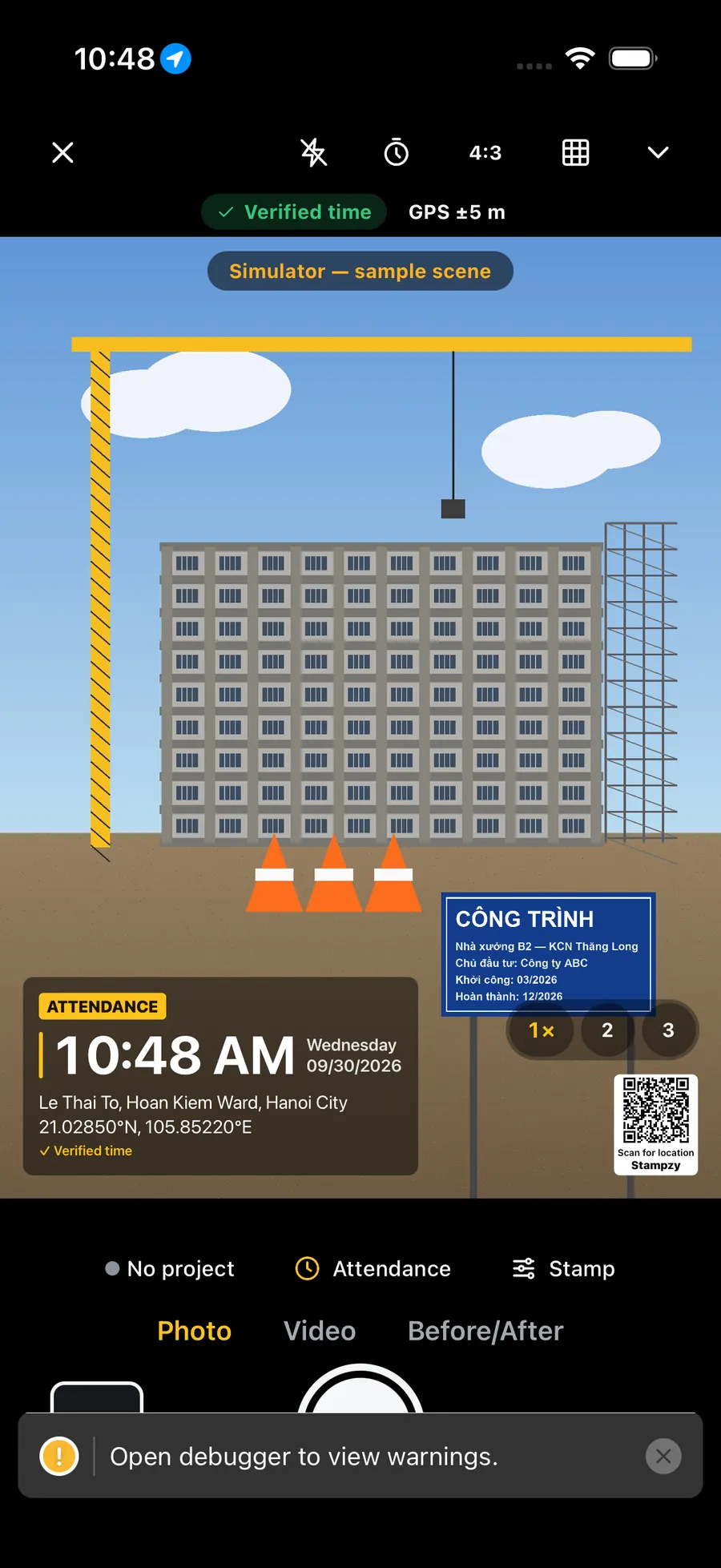 The Stampzy camera with an Attendance stamp on the viewfinder and a “Scan for location” QR code with the word Stampzy in the bottom-right corner